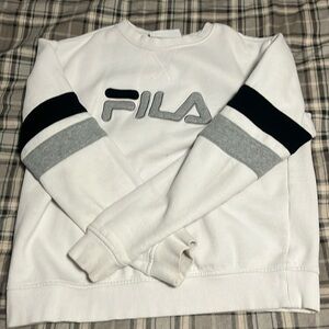 It is a Fila sweatshirt that is white, grey, and black.